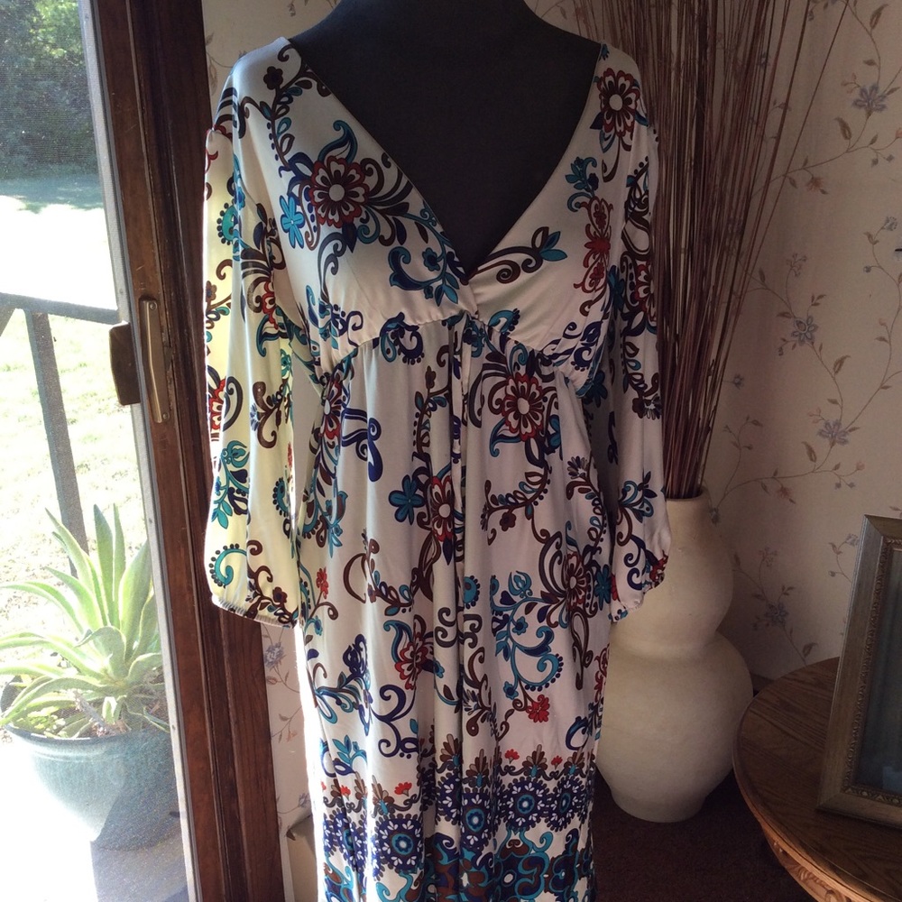 Turquoise cream and brown dress with v neck.